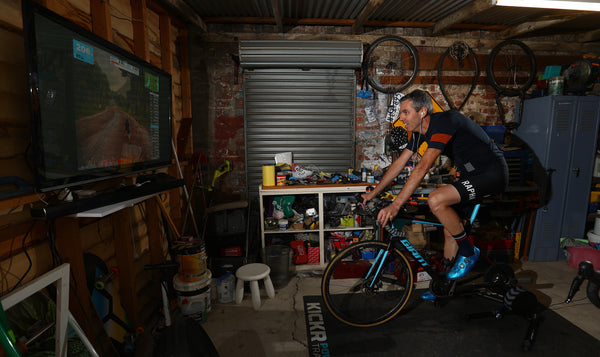 Man cycling indoors, turbo training to test FTP